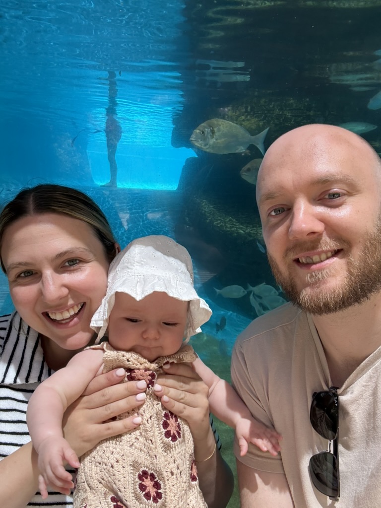Anthony with his partner Beth and their daughter Sadie at an aquarium