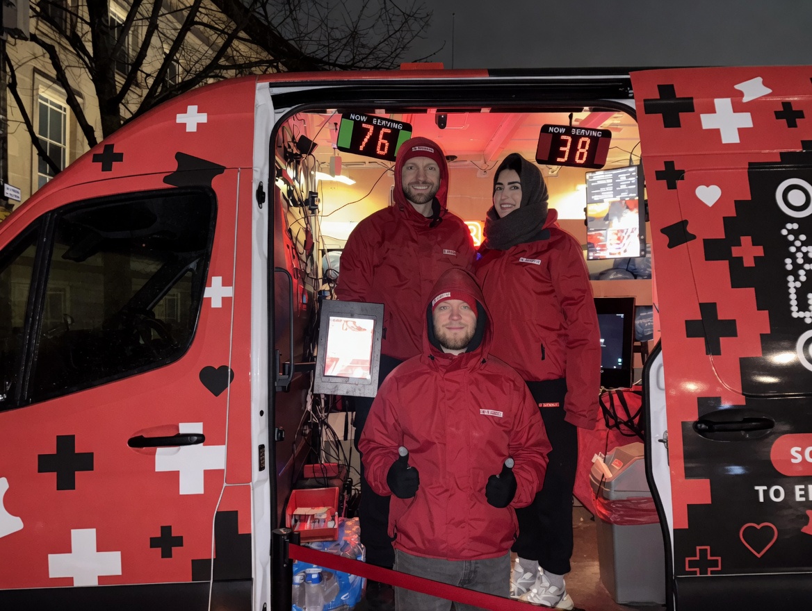 Anthony Hautin, Anton Hilton and Myda Carolan in the red Raffle Aid van